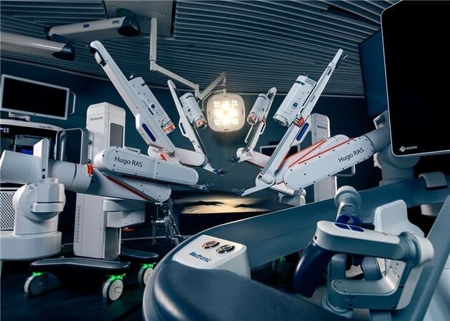 Advanced medical imaging equipment with multiple robotic arms and surgical instruments arranged in a sterile operating room environment